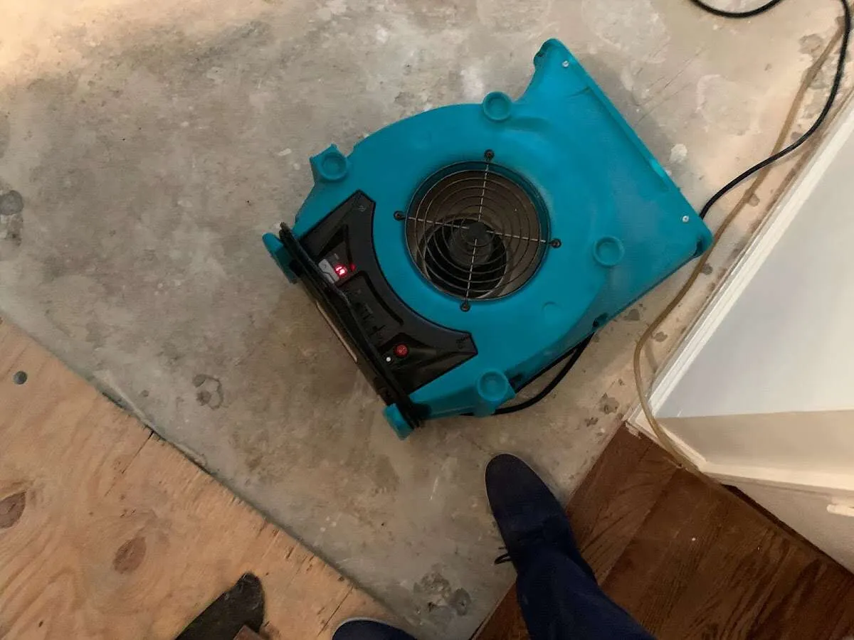 Air mover drying subfloor during Leak Detection & Repair in Melbourne